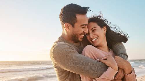 young couple with bright smiles in coral gables